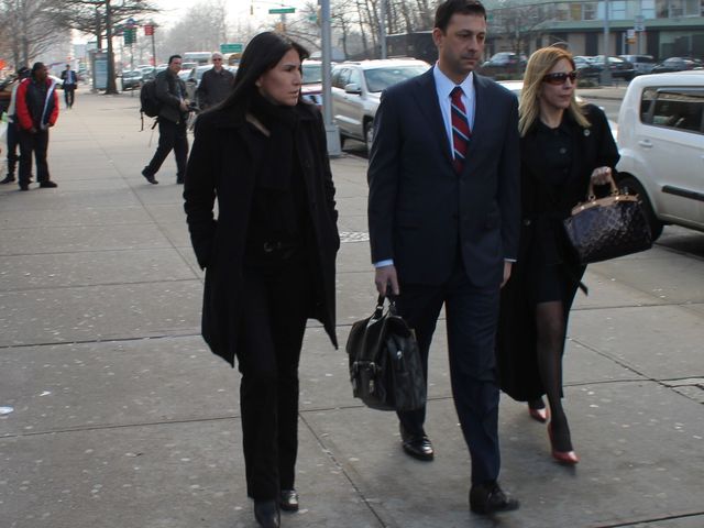 <p>Thomas Kenniff, the lawyer for accused subway pusher Erica Menendez, outside the court house on January 29, 2013, with Menendez's family members.</p>

