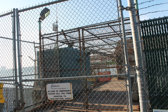 <p>A sign on the station tells viewers to call Houston if there is a problem. Area politicians are concerned because the new station will be monitored remotely.</p>
