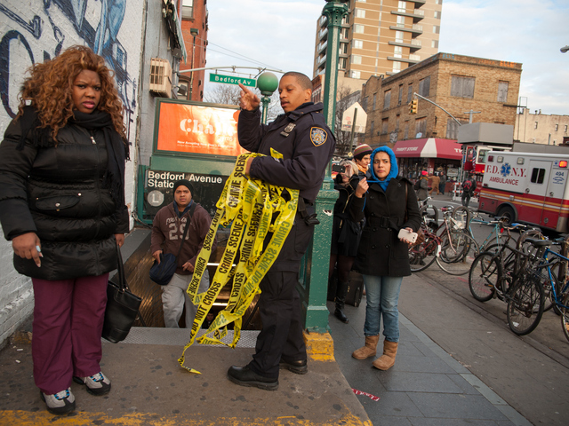 <p>Commuters are directed off the platform at the Bedford Avenue stop for the L Train, where a woman was struck on Monday Jan. 21, 2013.</p>
