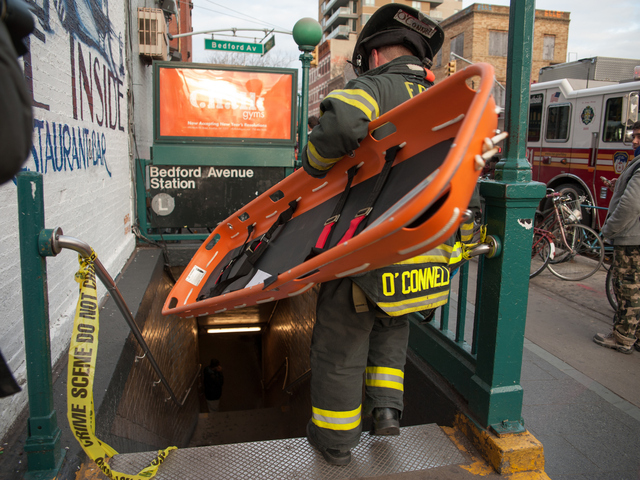 <p>Emergency responders on the scene at the Bedford Avenue stop for the L Train, where a woman was struck on Monday Jan. 21, 2013.</p>
