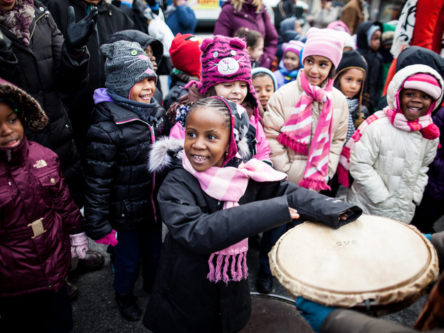 <p>A young girl enjoys the 36th Annual Three Kings Day Parade in East Harlem on Jan. 4, 2013.</p>
