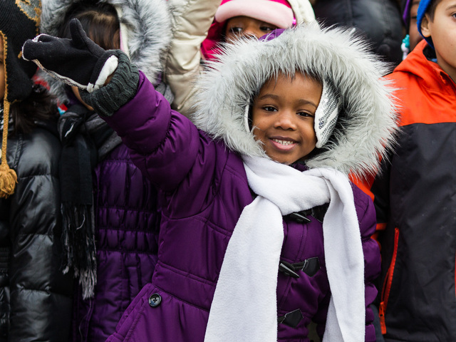<p>A young girl enjoys the annual Three Kings Day Parade in Harlem on Jan. 4, 2013.</p>
