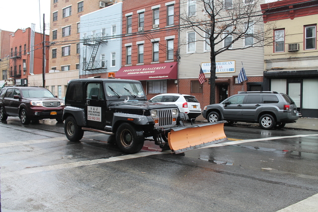 <p>A snowplow drives down Astoria Boulevard on Feb. 8, 2013 in preparation for an approaching blizzard, Winter Storm Nemo.</p>

