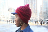 <p>Athanaelle Paul a fashion blogger, pairs a Brooklyn Dogers baseball cap with a University of Alabama beanie.</p>
