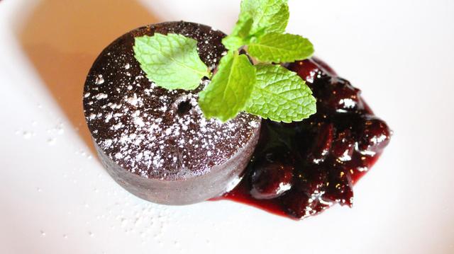 <p>Bareburger's flourless chocolate cake with an amarena cherry compote.</p>
