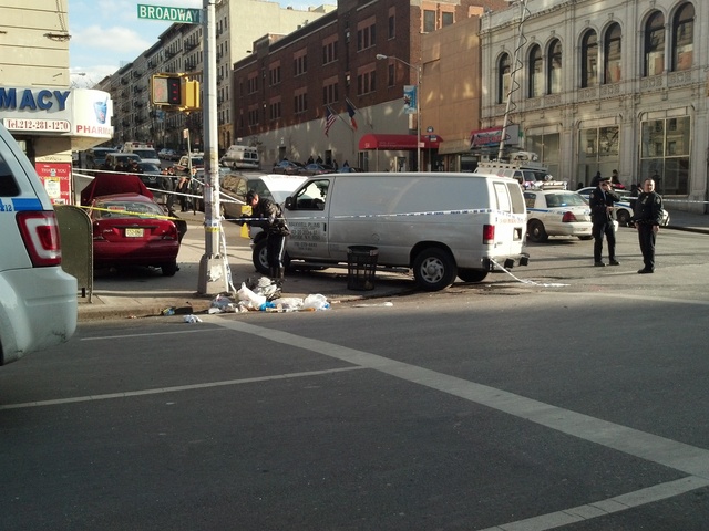 <p>A white van and a red Ford Focus crashed at Broadway and 135th Street Feb. 6, 2013.</p>
