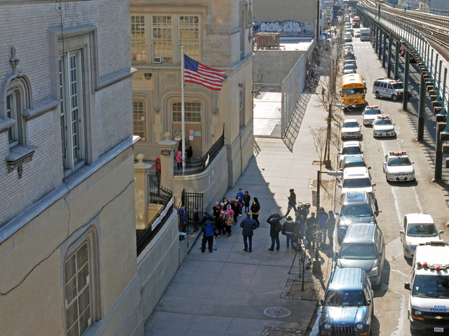 <p>Police and media descend on P.S. 33 on Jerome Avenue in The Bronx after a man allegedly tried to abduct an 8-year-old student, Feb. 21, 2013.</p>
