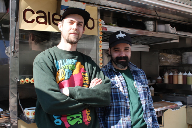 <p>Calexico food cart supervisor Ethan Stickley, left, and line cook Anthony Suarez, working in Worth Square Feb. 15, 2013, said they would welcome a market in the plaza. "It's actually a lot of fun for us," Suarez said.</p>
