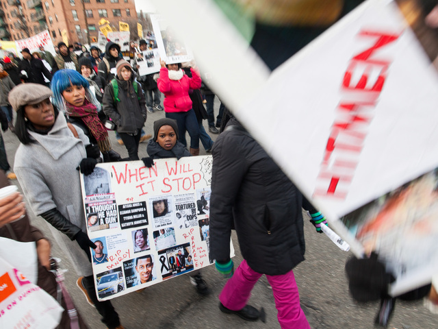 <p>A child attends the one-year anniversary rally for Ramarley Graham - a teenager who was gunned down by an NYPD officer - in the Bronx on Feb. 2, 2013.</p>
