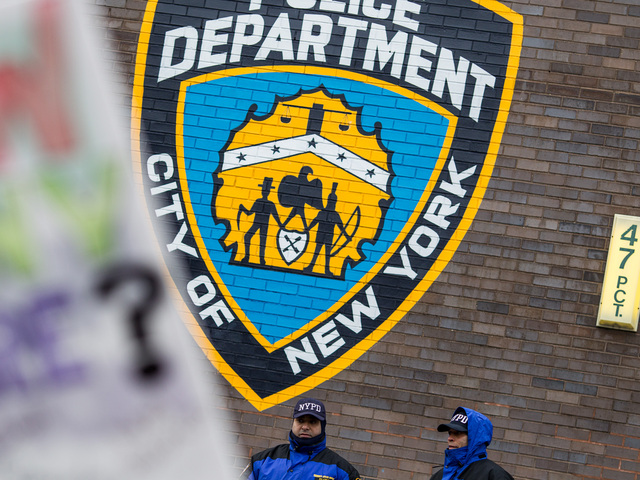 <p>Community officers outside the 47th NYPD Precinct in the Bronx during the one-year anniversary march for Ramarley Graham - the teenager who was gunned down by an NYPD officer - in the Bronx on Feb. 2, 2013.</p>
