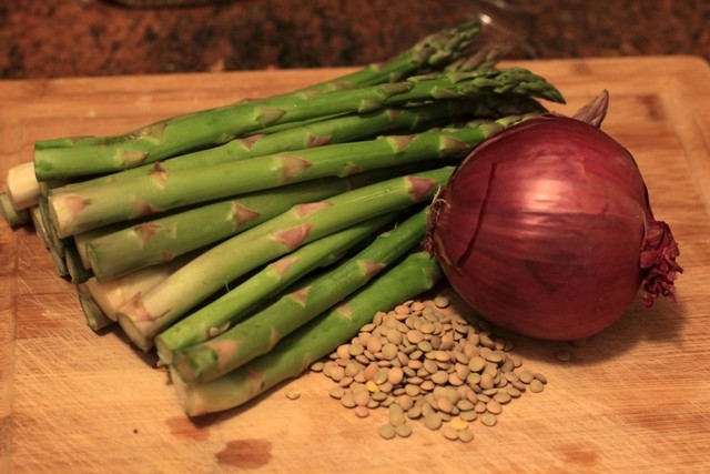 <p>Asparagus, lentils and red onion combine in this cold salad to add a biting contrast to the richness of the salmon and the sauce.</p>
