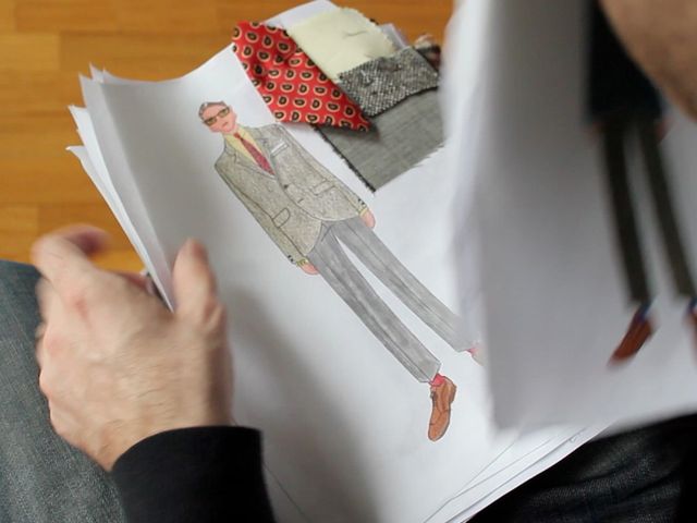 <p>David Hart flicks through looks for his collection that will debut at Fashion Week on Thursday.</p>
