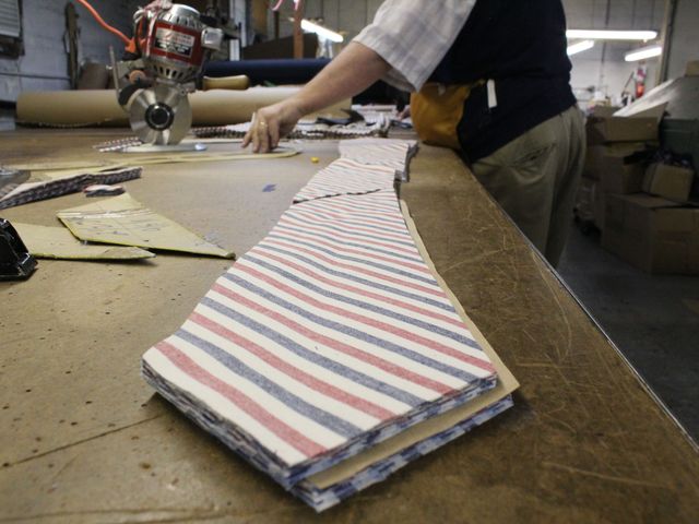 <p>Ties, handmade for David Hart's fashion collection, go through a ten-step process of cutting, stitching and pressing.</p>
