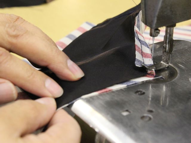 <p>Ties, handmade for David Hart's fashion collection, go through a ten-step process of cutting, stitching and pressing.</p>
