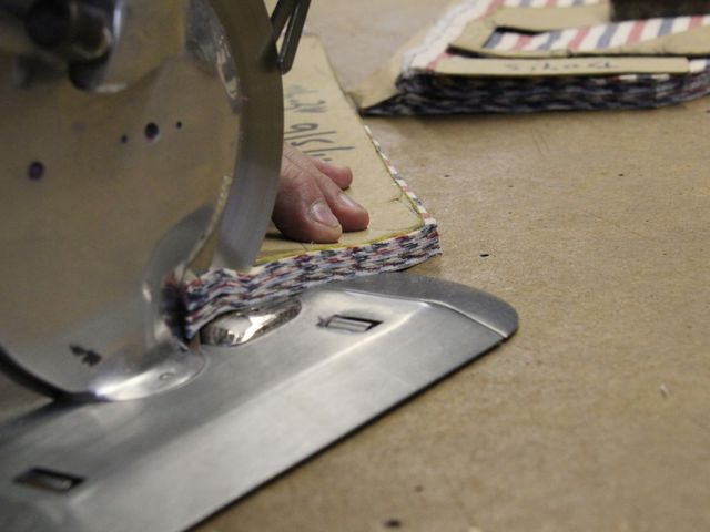 <p>Ties, handmade for David Hart's fashion collection, go through a ten-step process of cutting, stitching and pressing.</p>
