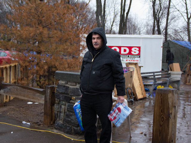 <p>Dominick Spagnolo, 58, grabbed some water at the Cedar Grove Community Hub before making preparations for Winter Storm Nemo at his home damaged by Hurricane Sandy, Feb. 8, 2013.</p>
