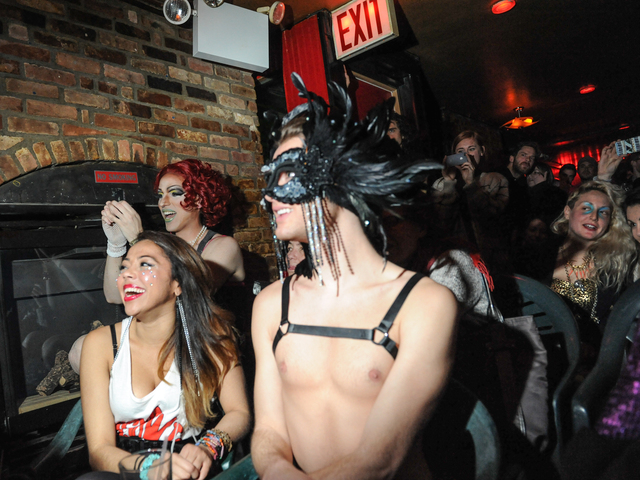 <p>Some judges and audience members enjoy the show.</p>
