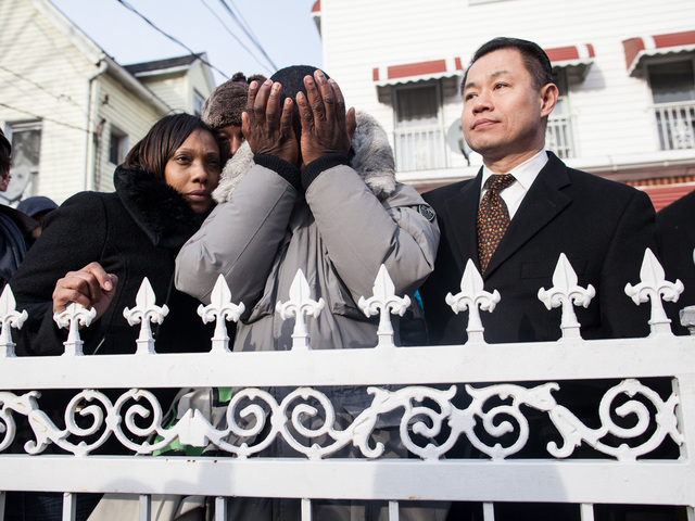 <p>Franclot Graham, the father of slain teenager Ramarley Graham is overcome with grief and is comforted by Constance Malcolm, the mother of the slain teenager, and also City Comptroller John Liu at the one-year anniversary for his teenage son in the Bronx on Feb. 2, 2013.</p>
