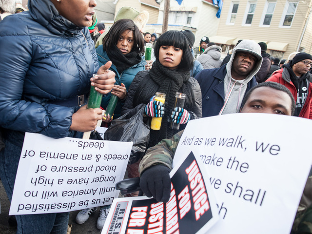 <p>Friends light candles at the one-year anniversary vigil for Ramarley Graham, the Bronx teenager who was gunned down by a cop in 2012.</p>
