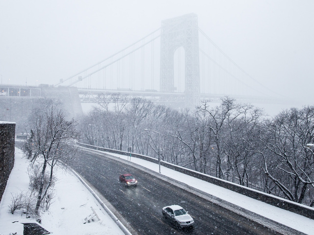 <p>The George Washington Bridge in Washington Heights is shrouded in mist as a massive snowstorm hits New York City on Feb. 8, 2013.</p>
