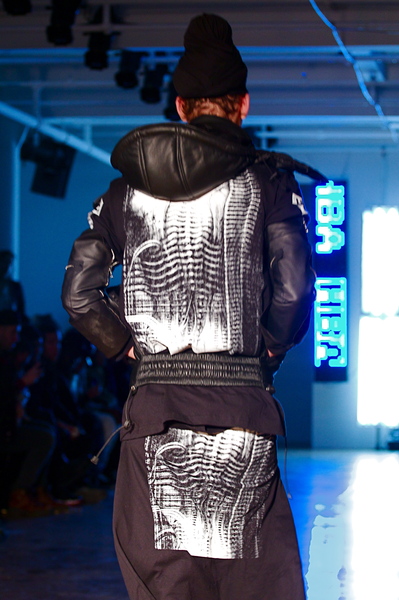 <p>Printing on the back of a leather puffer vast and matching graphic t-shirt</p>
