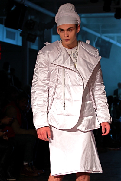 <p>Light puffer jacket with dramatic collar and shirt- skirt detail</p>
