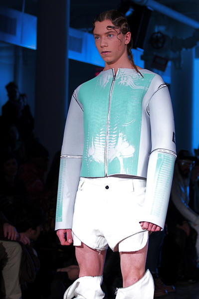 <p>Green and light grey neoprene jacket and transformative pants</p>
