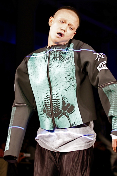 <p>Neoprene jacket look on performance artist Boychild</p>
