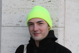 <p>Joel Fiekel wears a acid yellow beanie he borrowed from brother.</p>
