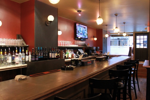<p>The restaurant is spacious with a bar at the front and a separate sit-down area and an open kitchen in the back.</p>

