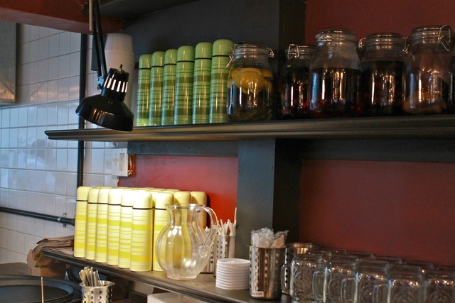 <p>In addition to the infusions, the shelves are adorned with row after row of green and yellow Thermos bottles, which are used to serve coffee, said Arnon Magel, owner of Kipsey's.</p>
