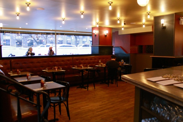 <p>The restaurant is spacious with a bar at the front of the space, a separate sit-down area and an open kitchen in the back.</p>
