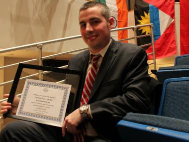 CB8 Chairman Nick Viest gave prizes to electeds' reps who kept their presentations to the board "short and sweet."
