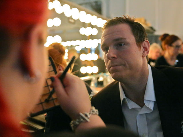<p>Joshua Kaston, Vice President of Financial Alliance Processing Services, has his makeup done before the Michael Fenici runway show. "I am 6'2 and 220-lbs," Kaston said. " I am not a traditional model size."</p>
