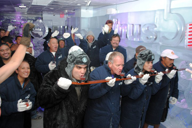 <p>Guests sling back shots at Minus5 Ice Bar in Las Vegas. The bar, which has two locations in Sin City, is opening its third at the Hilton New York in Midtown Manhattan in March 2013. Virtually every aspect of the bars are made from ice, from the tables and drink glasses to the benches and walls.</p>
