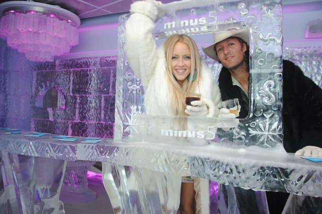 <p>Guests pose for a photo at Minus5 Ice Bar in Las Vegas. Minus5 has two locations in Sin City, and it's opening a third at the Hilton New York in Midtown Manhattan in March 2013.</p>
