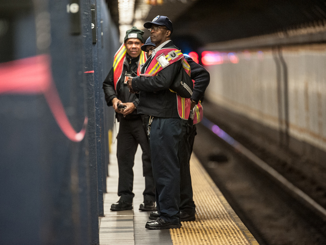 <p>MTA workers in the wake of a fatal train incident in Crown Heights on the platform on Tuesday February 12th, 2013.</p>
