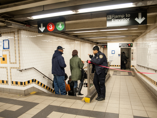 <p>A police officer directs passengers to the platforms still in operation on Tuesday February 12th, 2013.</p>
