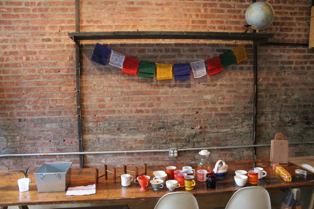 <p>Prayer flags adorn the wall of Goodies, which is still under renovation behind Good Yoga in Bed-Stuy.</p>
