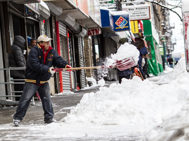 <p>A resident in Washington Heights clears snow off the sidewalk on 181st. Street, between Broadway and Fort Fort Washington Avenue, on Feb. 9, 2013.</p>
