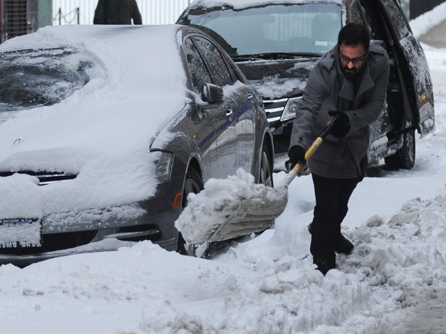 <p>A man shovels his car out on Wooster Street after the snowstorm on Feb. 9, 2013.</p>
