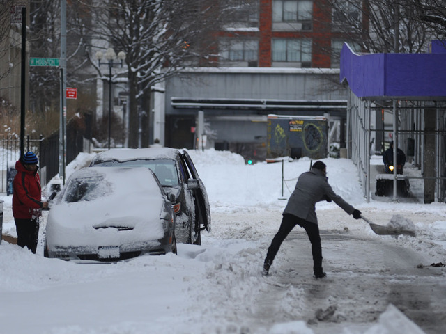 <p>People clear snow on Wooster Street after the snow storm on Feb. 9, 2013.</p>
