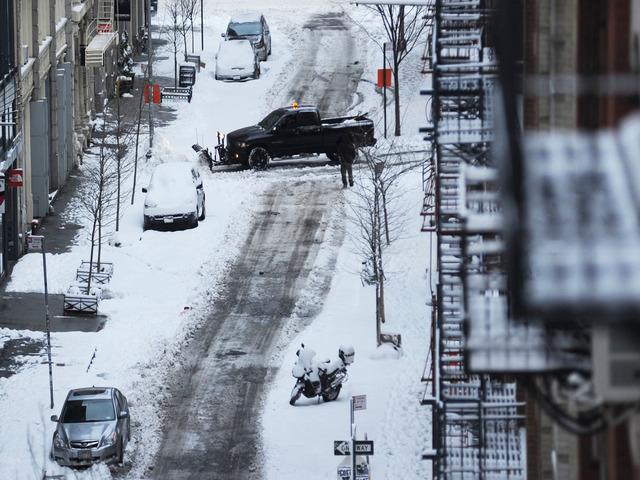 <p>A plow crosses Prince Street at Wooster Street after Winter Storm Nemo on Feb. 9, 2013.</p>
