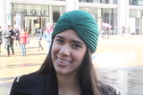 <p>Suzette Quiros, a model and actress, wears a green turban at New York's Fashion Week.</p>
