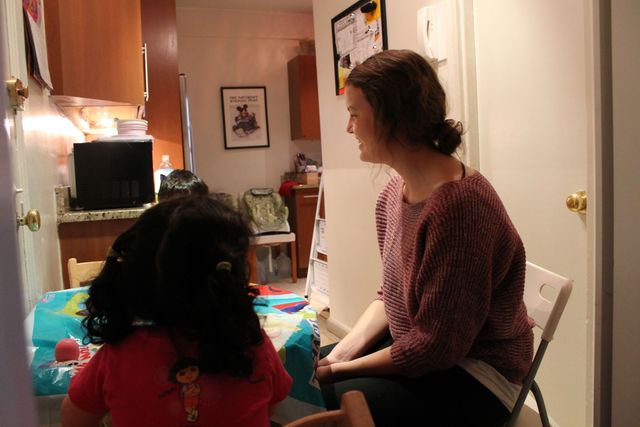 <p>The Molinaris' au pair Elin Nilsson dines with the older set of twins.&nbsp;</p>
