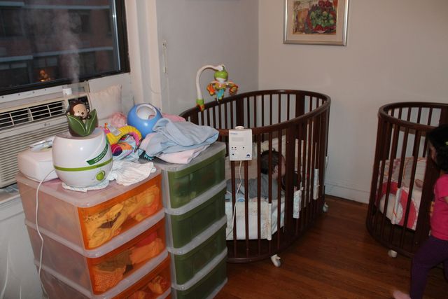 <p>The twins' cribs and their changing table and dressers take over part of Micol Molinari's bedroom.&nbsp;</p>
