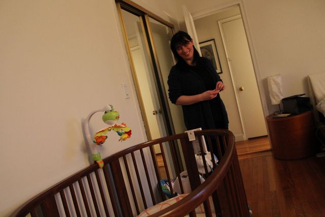 <p>Micol Molinari looks in on her youngest twins, who are 10 months old.&nbsp;</p>
