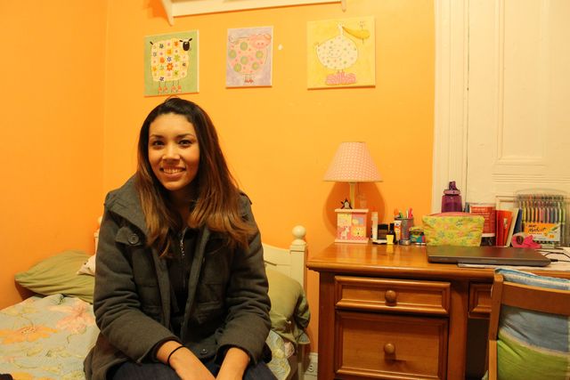 <p>Dora Freitas, 23, (pictured here in her room) is from Brazil and said she enjoys learning about American culture while living with the Treitler family.</p>

