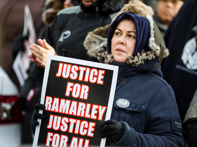 <p>A woman attends the one-year anniversary of Ramarley Graham - the teenager who was gunned down by an NYPD officer - in the Bronx on Feb. 2, 2013.</p>
