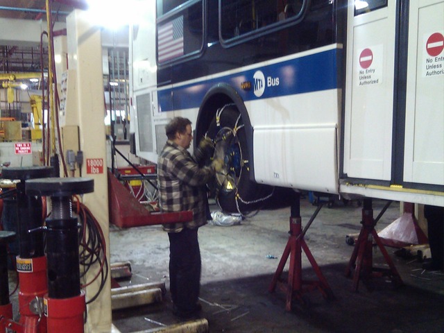 <p>Workers lashed bus tires with chains as the Metropolitan Transportation Authority prepared for Winter Storm Nemo to blast New York City on Friday Feb. 8, 2013.</p>
